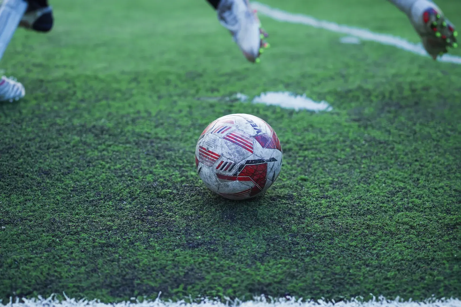 A soccer ball on a green grass field